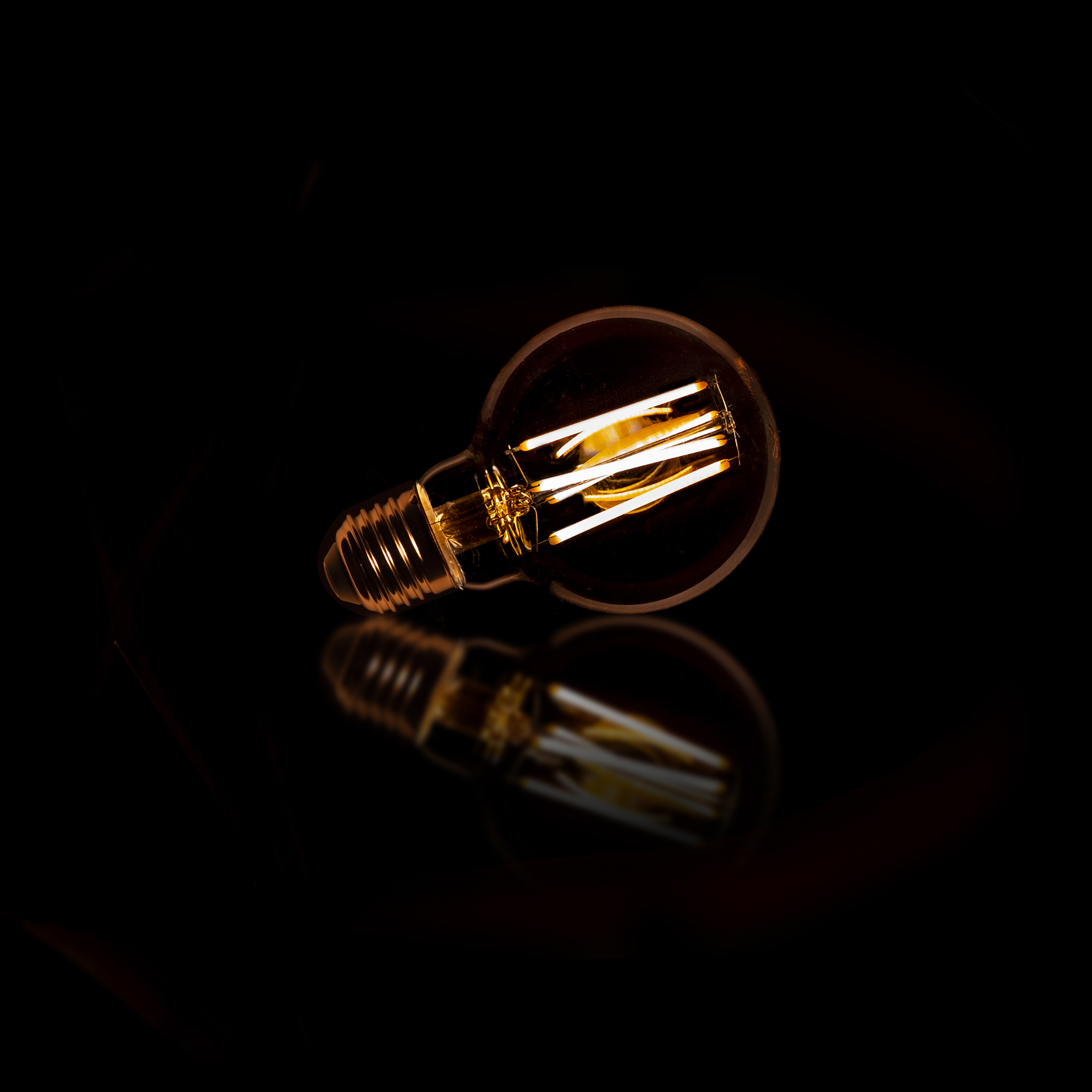 Source lumineuse LED [G70] boule à filament Ø7 / Verre ambré
