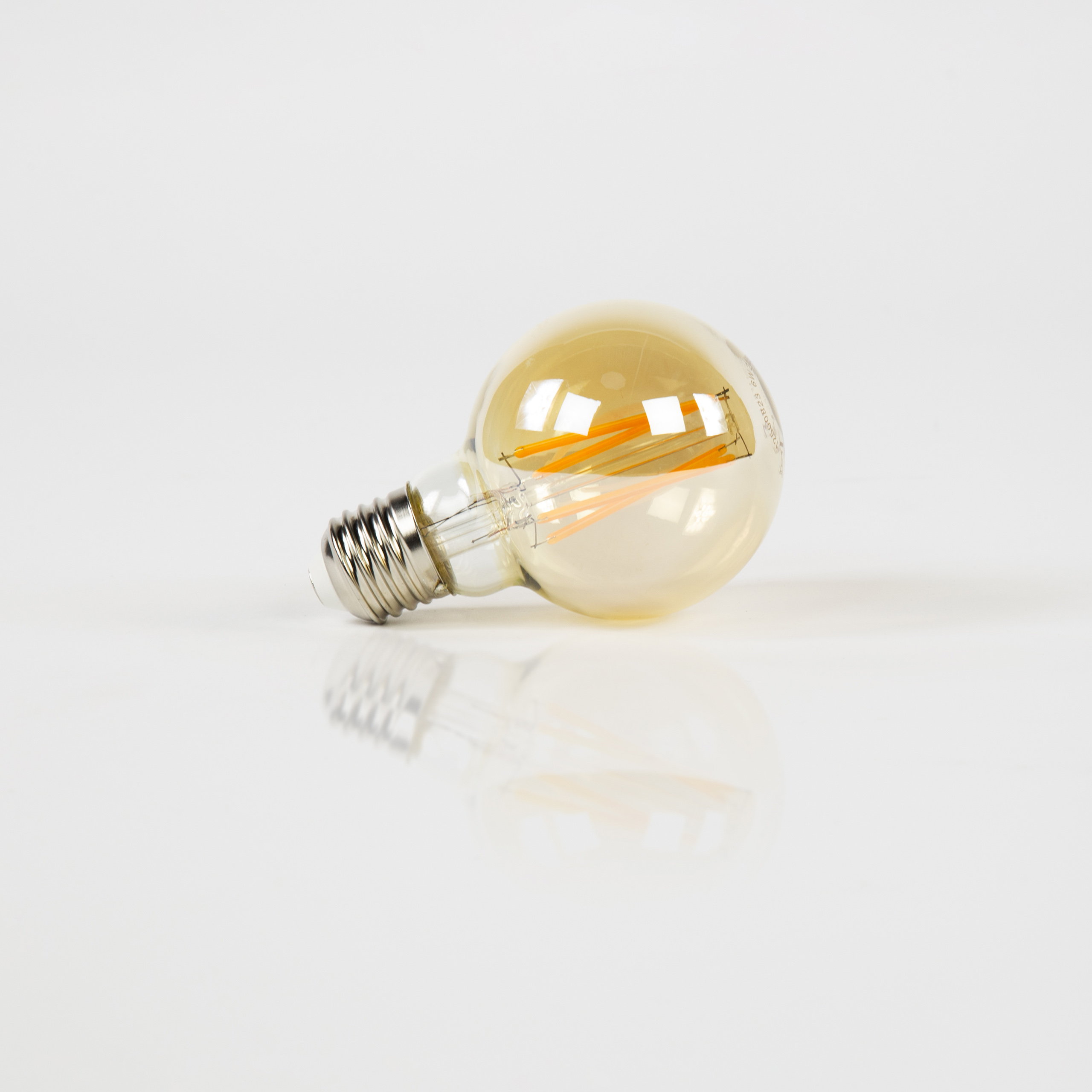 Source lumineuse LED [G70] boule à filament Ø7 / Verre ambré